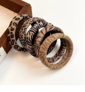 Close-up of high-elastic leopard and animal print hair ties set with soft velvet texture