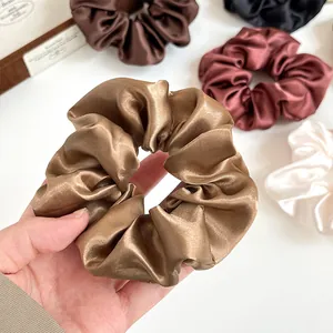 Set di elastici per capelli in raso lucido nei colori champagne e toni della terra