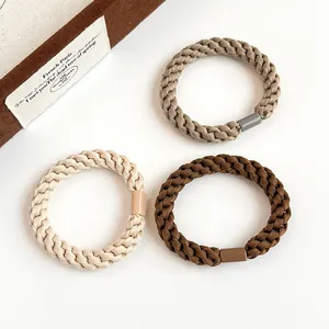 Three-piece set of thick elastic braided hair ties in coffee and earthy tones