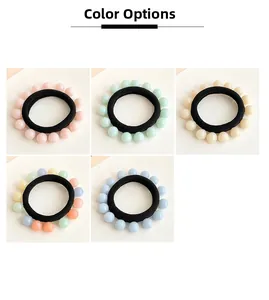 Close-up of seamless jelly-colored pearl hair ties in five pastel shade variations