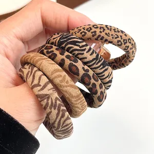 Set of five vintage leopard and zebra print elastic hair scrunchies in earth tones