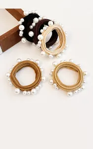 Close-up of seamless elastic hair ties with white pearls in multiple earth tones