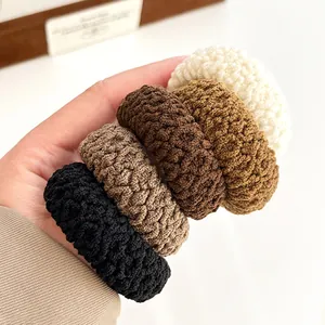 Five-pack of thick knitted elastic hair ties in neutral earthy tones for women