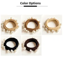 Detail showing five colors of elastic hair ties with different sized faux pearls