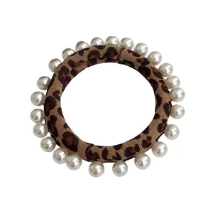 Leopard print hair scrunchie with white pearl trim and high elastic band for women