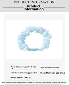 Detailed product information of light blue organza scrunchie with 7cm outer diameter