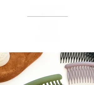 Close-up of matte finish hair combs in black, morandi purple, and green colors