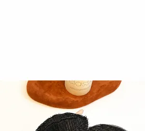 Detail of invisible black mesh hair volume pad on a display tray for hair styling