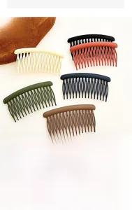 Detail view of colorful matte finish hair side combs for styling bangs and flyaways