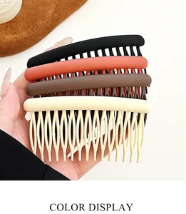 Close-up of four matte hair combs in black, red, coffee, and beige for hairstyling