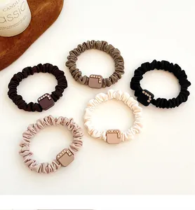 Set of five elegant scrunchies in earth tones with rhinestone square buckles detail