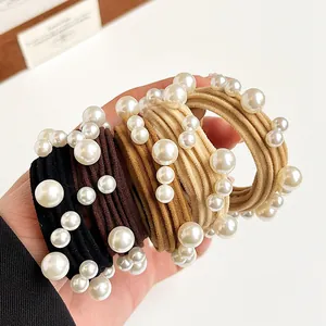 Elastic pearl hair ties set in earth tones including black, coffee, brown and beige
