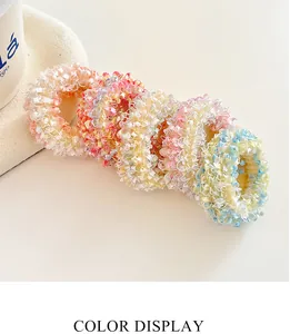 Detail of 5-piece colorful boucle elastic hair ties in pastel ice cream shades