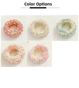 Detailed color selection of five pastel macaron elastic hair scrunchies with ruffled texture