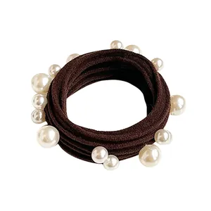 Brown elastic hair tie with white pearls for ponytail styles on white background