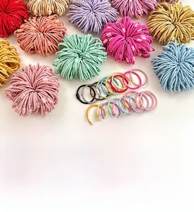 Detailed view of colorful high-elasticity braided hair ties with matching square connectors