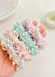 Close-up of candy-colored popcorn textured hair tie with high elastic fabric detail
