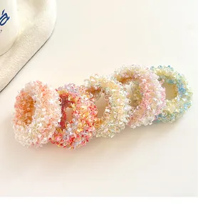Close-up of 5 pastel elastic hair ties set with ruffled lace texture and macaron colors