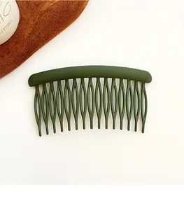 Detailed close-up of dark green matte hair comb with 17 teeth for elegant styling