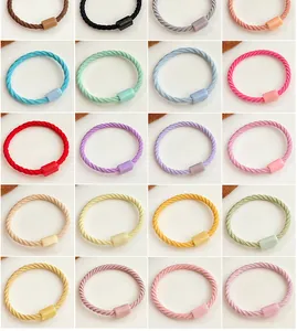 Macro shot of 20 assorted colorful braided hair ties with high elasticity and spiral texture