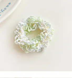 Macro shot of high-elasticity woven light green hair tie with soft wool fiber texture