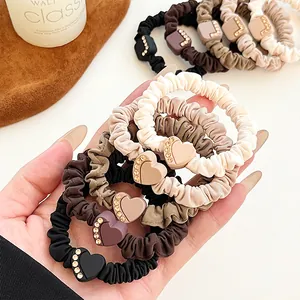 Elastic heart rhinestone hair ties in mocha and coffee tones for elegant ponytails