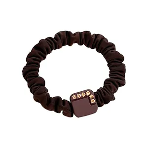 Deep coffee brown ribbed hair tie with square rhinestone buckle in a clean white background