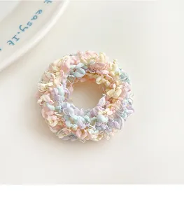 Macro shot of candy-colored elastic hair ties with woven texture and macaron shades