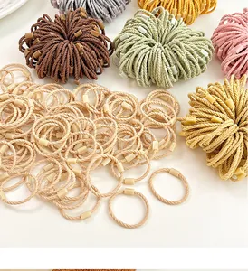 Close-up of multicolored braided elastic hair bands with small rectangular resin buckles