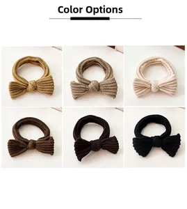 Selection of six ribbed bow hair ties in mustard, cream, and coffee tones for ponytails
