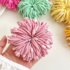 Colorful high-elastic spiral hair ties for kids shown held in hand against white background