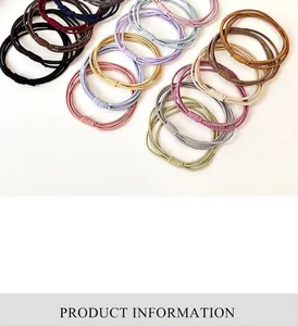 Detail of high-elastic multi-strand hair ties in assorted Morandi colors on white background