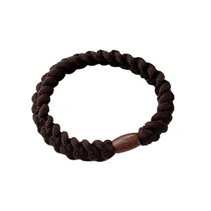 Dark brown braided high elasticity hair tie with smooth resin connector on white background
