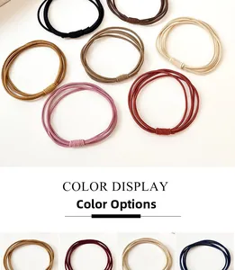 Close-up of durable multi-strand braided elastic hair ties in various colors