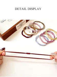 Detail display of high-elastic multi-strand hair ties showing superior stretch and durability