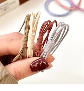 Gros plan d'élastiques à cheveux haute élasticité aux teintes douces de Morandi