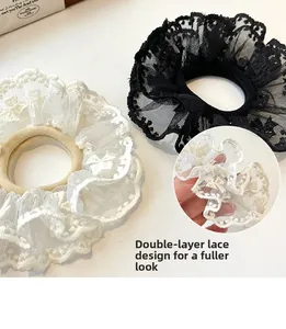 Detail of double-layer lace hair scrunchie showing fine mesh texture and 3D effect