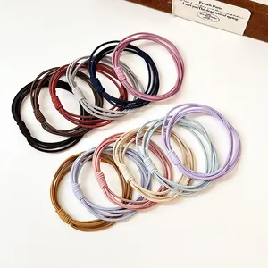 Élastiques à cheveux multi-brins haute élasticité en couleurs variées sur fond blanc