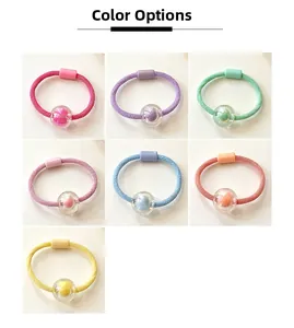 Close-up detail showing candy-colored elastic hair ties with transparent bead accents