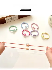 Detail view of colorful candy-colored elastic hair ties with transparent bead charms
