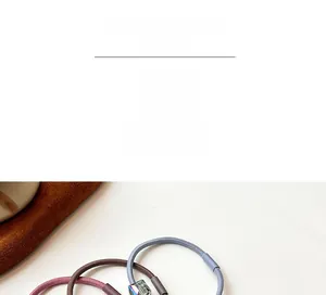 Detail of high-elasticity hair ties with colorful iridescent translucent square beads