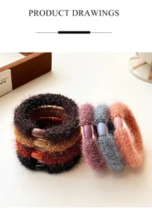 Detailed close-up of colorful plush hair scrunchies with decorative resin beads