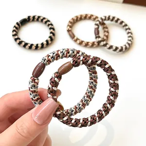 Elastic braided hair ties in neutral earth tones with resin joint for ponytail
