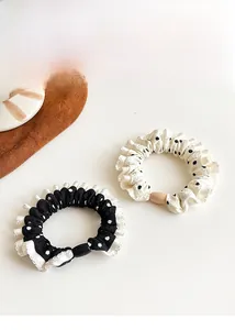 Polka dot hair scrunchies with ruffled lace edges in black and white set of two