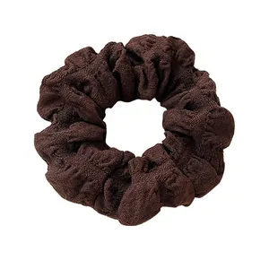 Brown puff scrunchie for women made of durable textured woven fabric for hair styling