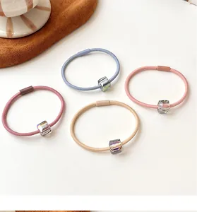 Detail of high-elasticity hair ties with transparent square crystal beads in four colors