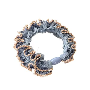 Blue denim texture scrunchie with lace trim and oval bead detail for ponytails