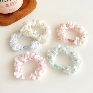 5-piece set of colorful polka dot hair scrunchies in pastel yellow blue pink and green