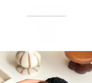 Macro detail of thick black knitted hair tie with premium rhinestone embellishment