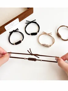 Détails d'élastiques à cheveux tissés haute élasticité avec perles dorées et nœuds décoratifs